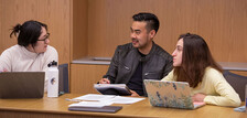 A small class meets in Baker Hall at the Law School.